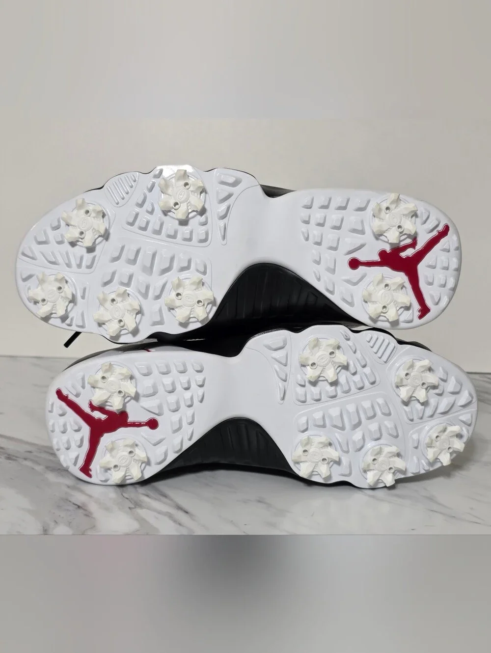 Jordan White and Black Golf Cleats with Red Logo